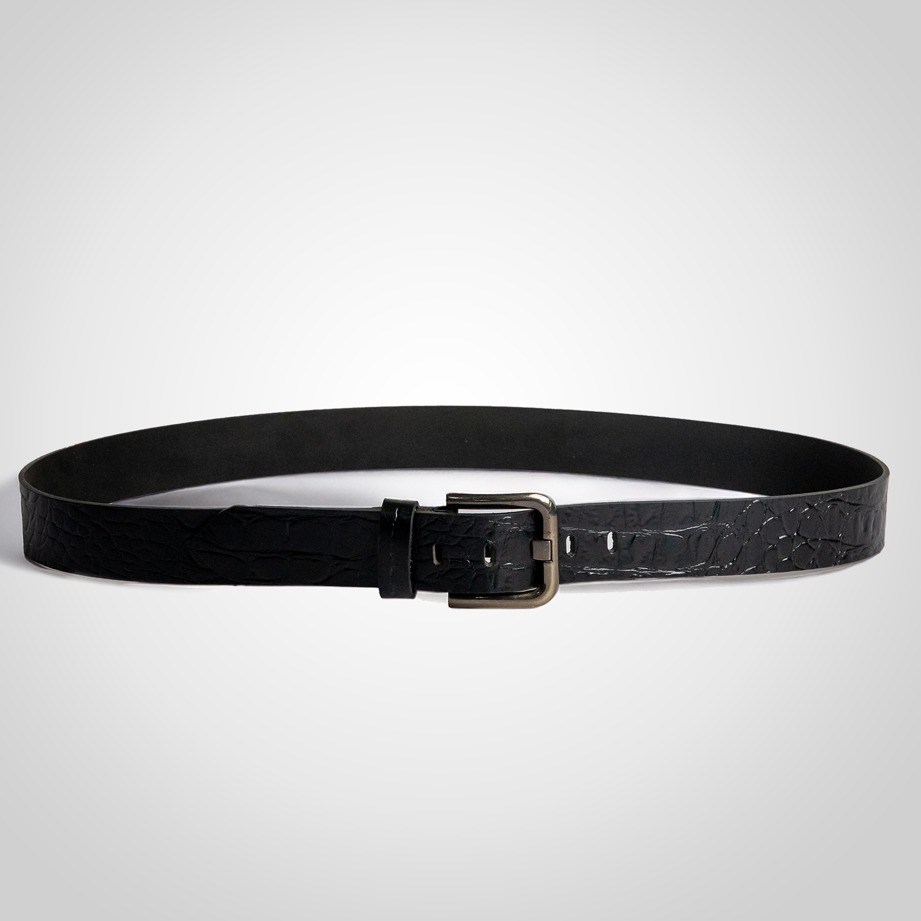 Black leather belt with a silver buckle on a light gray background