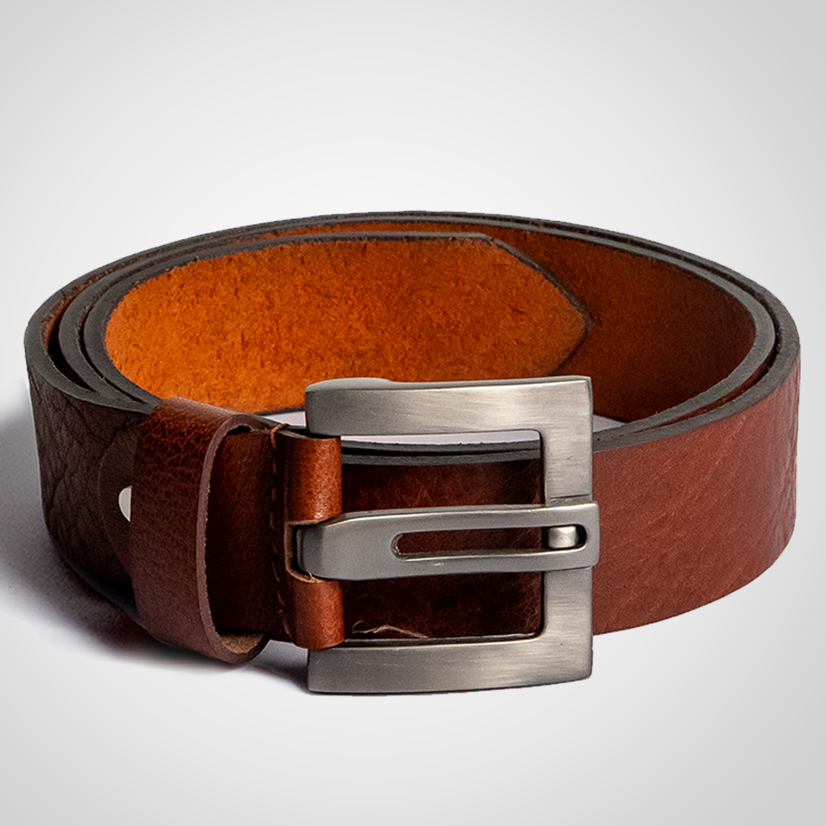 Brown leather belt with a silver buckle on a light gray background