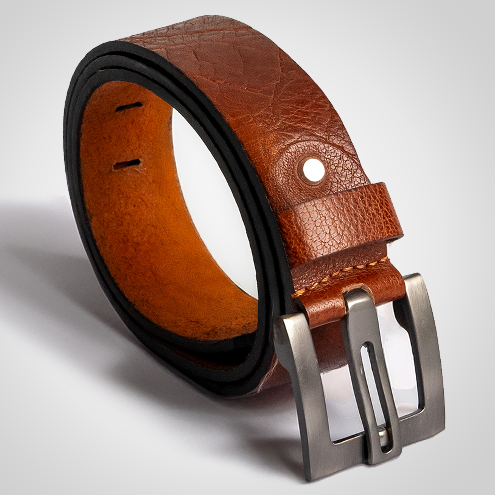 Brown leather belt with a silver buckle on a light gray background