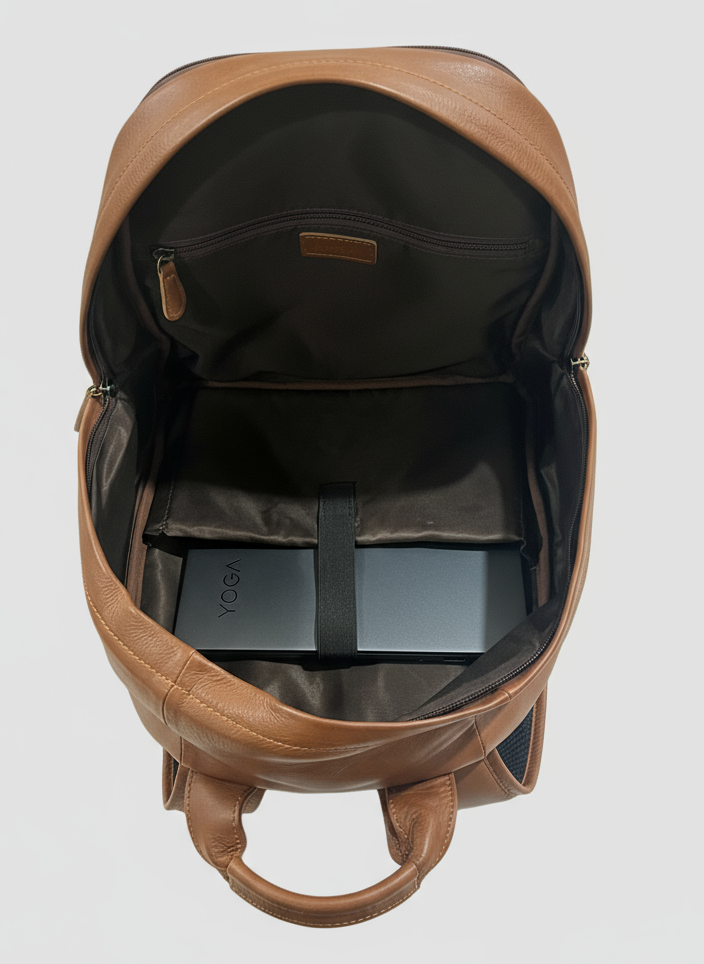 Brown leather backpack on a light gray background