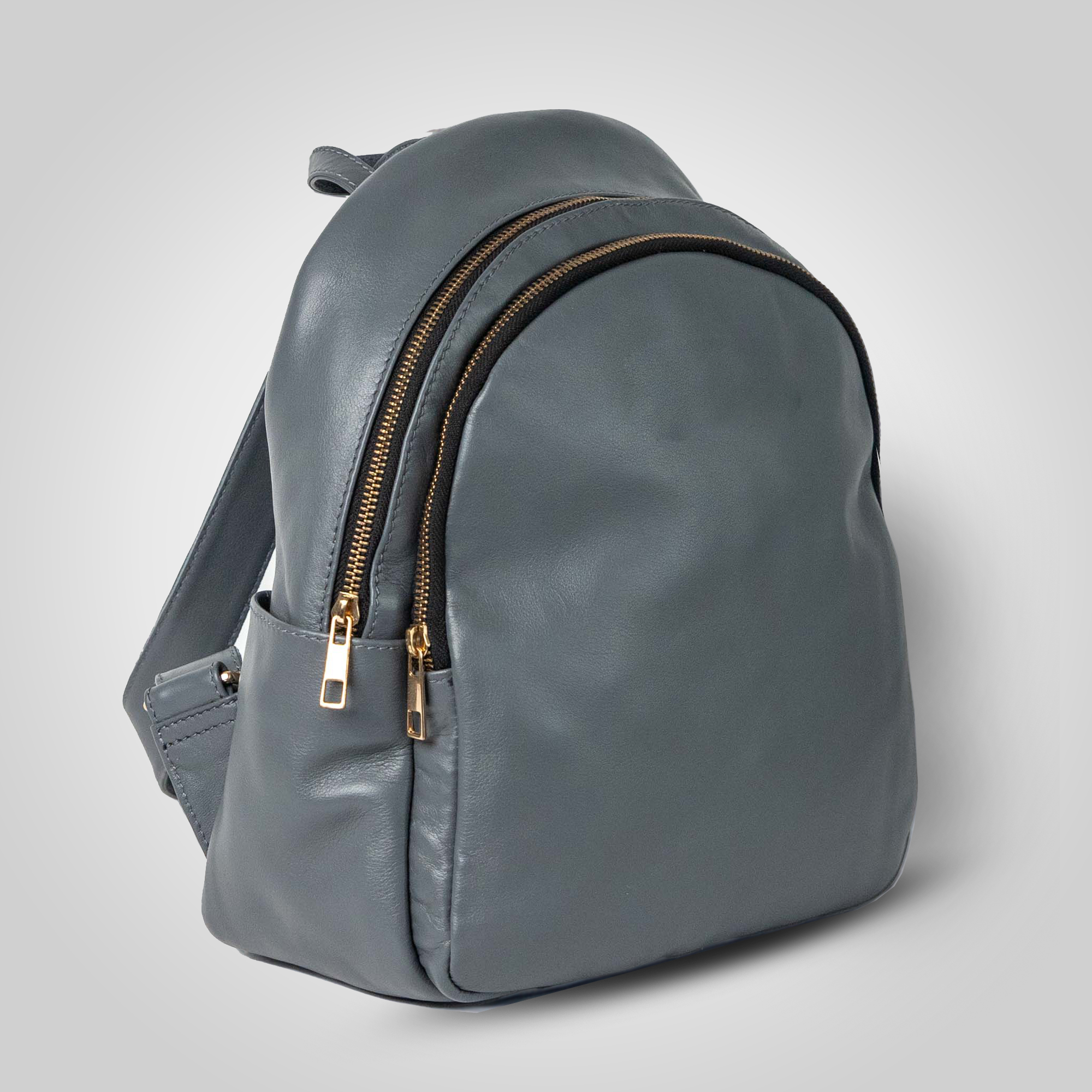 Gray backpack with gold zippers on a light gray background