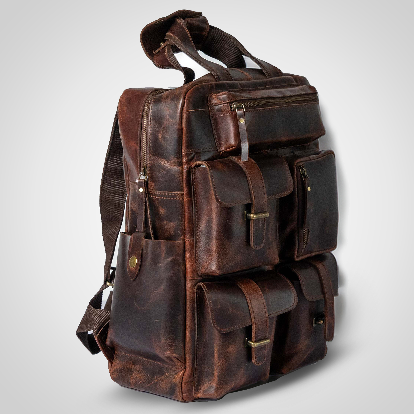 Side view of The Pathfinder genuine leather backpack showing structured design and detail stitching